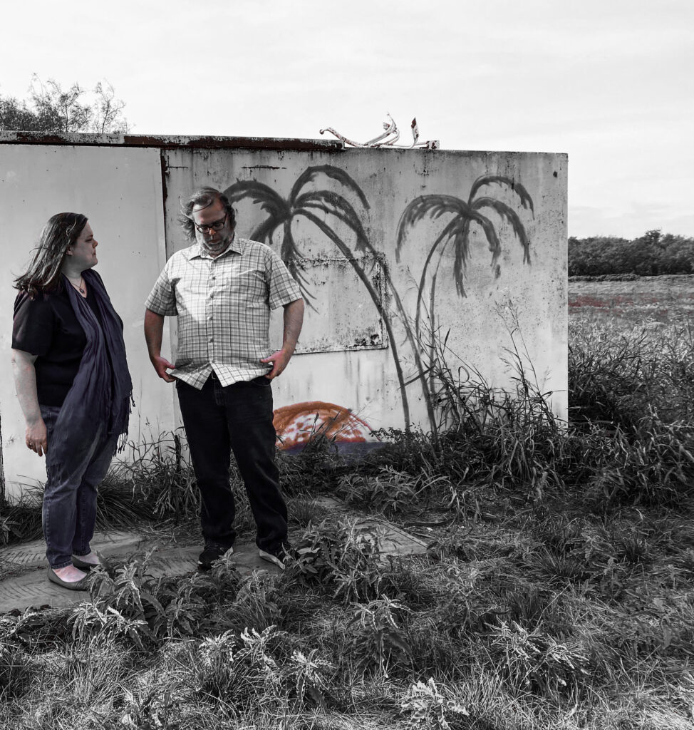 Keri & Kelly in a field with palm tree trailer